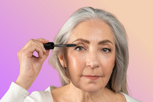 Woman applying mascara